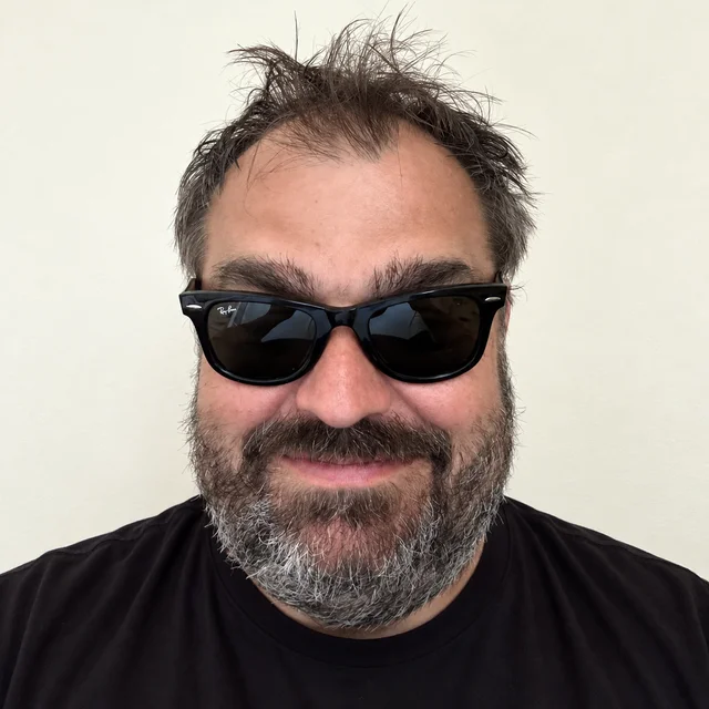 Marcin wearing sunglasses and a black T-shirt